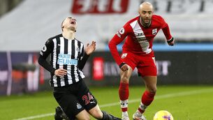 <p>AL IN: Newcastle's Paraguayan midfielder Miguel Almiron goes down under the challenge of Southampton's Nathan Redmond in the thriller at St James' Park. Steve Bruce's nine men hung on for a crucial three points. </p>