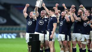 <p>BLUE HEAVEN: Scotland lift the Calcutta Cup after their shock 11-6 win over England at Twickenham.</p>