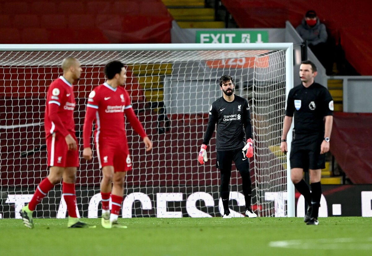 Liverpool goalkeeper Alisson appears dejected after Manchester City's Raheem Sterling (not pictured) scores their side's third goal of the game. Picture: Laurence Griffiths/PA Wire. 