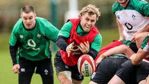 <p>ONE IN, ONE OUT: Munster’s Craig Casey gets a pass away during Ireland training as Johnny Sexton watches on. Casey will hope to make his Irish debut off the bench but Sexton misses out. <span class="contextmenu emphasis CaptionCredit">Pic: Inpho/Billy Stickland</span>
            </p>