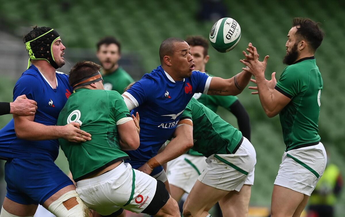 France's Gaël Fickou and Jamison Gibson-Park of Ireland tussle for a loose ball. Photo by Brendan Moran/Sportsfile