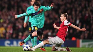 <p class="contextmenu internal_Caption">Arsenal’s Jack Wilshere challenges Barcelona’s Lionel Messi in the Champions League round of 16 clash at the Emirates, 10 years ago today. Picture: Shaun Botterill/Getty</p>