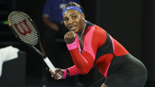 <p>Serena Williams clenches her fist during her victory over Simona Halep (Hamish Blair/AP)</p>