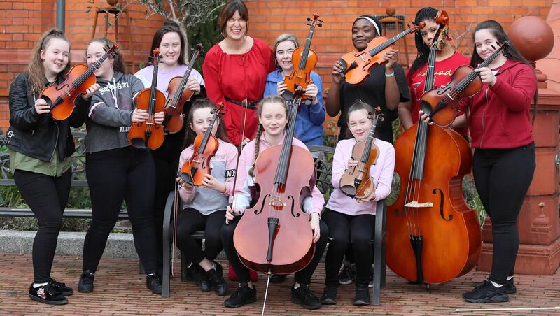 Deirdre Mortell, CEO of Rethink Ireland, with members of the 'Sing Out with Strings' project established by the Irish Chamber Orchestra to provide long-term free access to high‑quality music education in areas of acute social and economic disadvantage in Limerick. The project is an Awardee of the Rethink Ireland Youth Education Fund 2018-2021. Deirdre Mortell, CEO of Rethink Ireland, with members of the 'Sing Out with Strings' project established by the Irish Chamber Orchestra to provide long-term free access to high‑quality music education in areas of acute social and economic disadvantage in Limerick. The project is an Awardee of the Rethink Ireland Youth Education Fund 2018-2021.