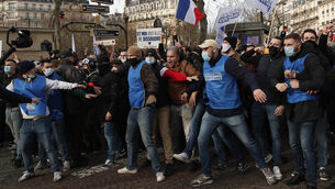 <p>Supporters of the movement Generation Identity demonstrate in Paris. Picture: AP</p>