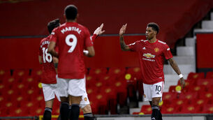 <p>Marcus Rashford, right, opened the scoring for Manchester United against Newcastle </p>