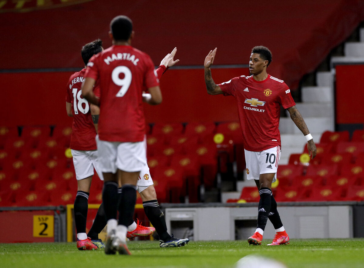 Manchester United's Marcus Rashford (right) celebrates scoring their side's first goal of the game.