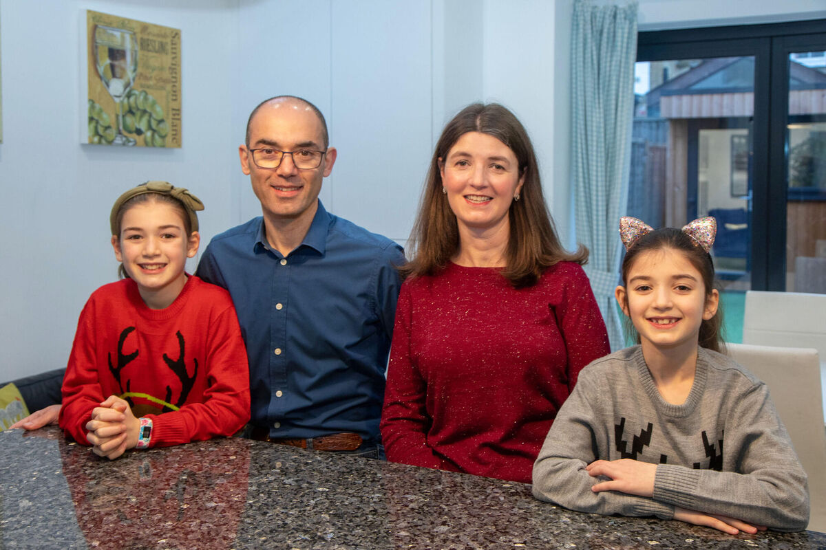 Author Emma Murray with her husband Sam and children Ava, left, and Anya in London.