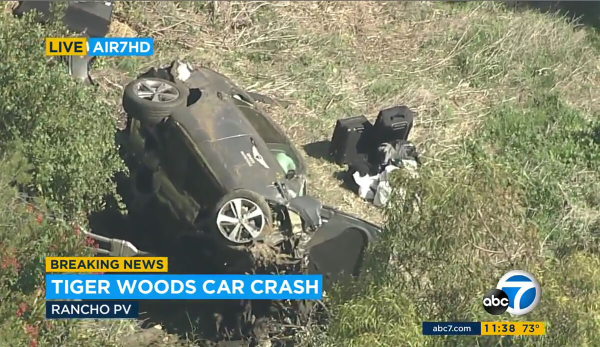 In this aerial image take from video provided by KABC-TV video, a vehicle rest on its side after a rollover accident involving golfer Tiger Woods along a road in the Rancho Palos Verdes section of Los Angeles on Tuesday, Feb. 23, 2021.