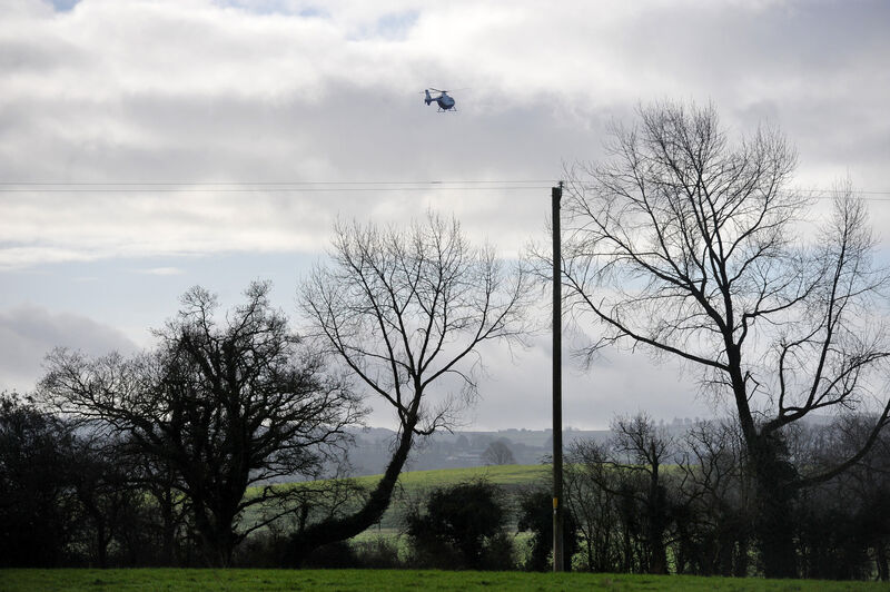 Garda helicopter overhead at the scene where the third body was found after a manhunt in North Cork this morning. Picture: Larry Cummins Garda helicopter overhead at the scene where the third body was found after a manhunt in North Cork this morning. Picture: Larry Cummins