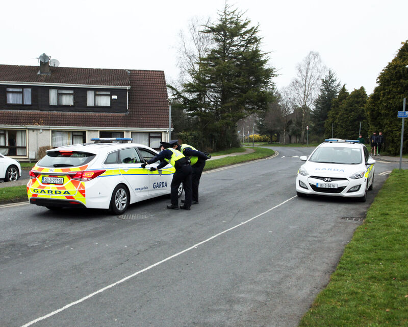More than 350 on-the-spot fines have been issued for Covid-19 breaches in the Castletroy area. Gardaí at a checkpoint at College Court, Limerick. Photo: Brendan Gleeson