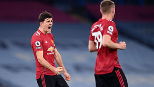 <p>Manchester United's Harry Maguire (left) celebrates after the final whistle. Picture: Laurence Griffiths/PA</p>