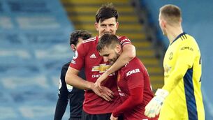 <p>Manchester United's Harry Maguire (left) congratulates team Luke Shaw after the final whistle at the Etihad Stadium. Picture: Dave Thompson/PA</p>