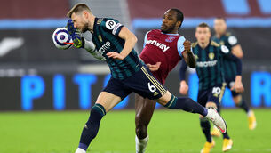 <p>Leeds United's Liam Cooper (left) and West Ham United's Michail Antonio battle for the ball at the London Stadium. Picture: Julian Finney/PA</p>