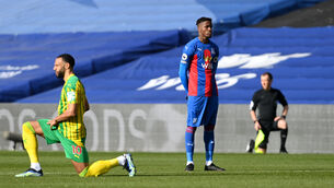 <p>Wilfried Zaha stood while other players took a knee. Picture: Mike Hewitt/PA</p>