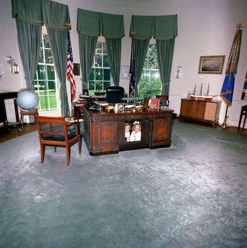 Caroline and John Kennedy inside the Resolute Desk in President Kennedy's Oval Office. Picture: White House Museum