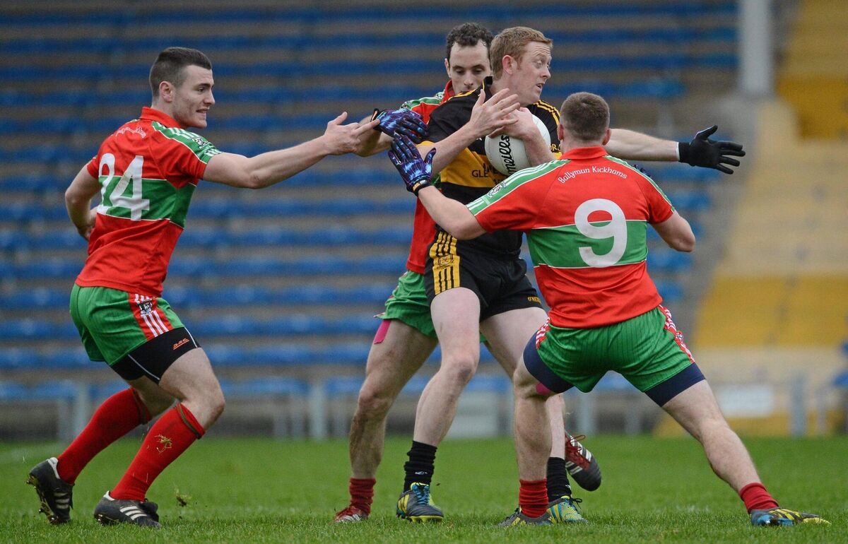 Colm Cooper, Dr Crokes, in action against Sean George, Karl Connolly and Davey Byrne, Ballymun Kickhams.