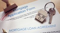 Mortgage application loan agreement and house key