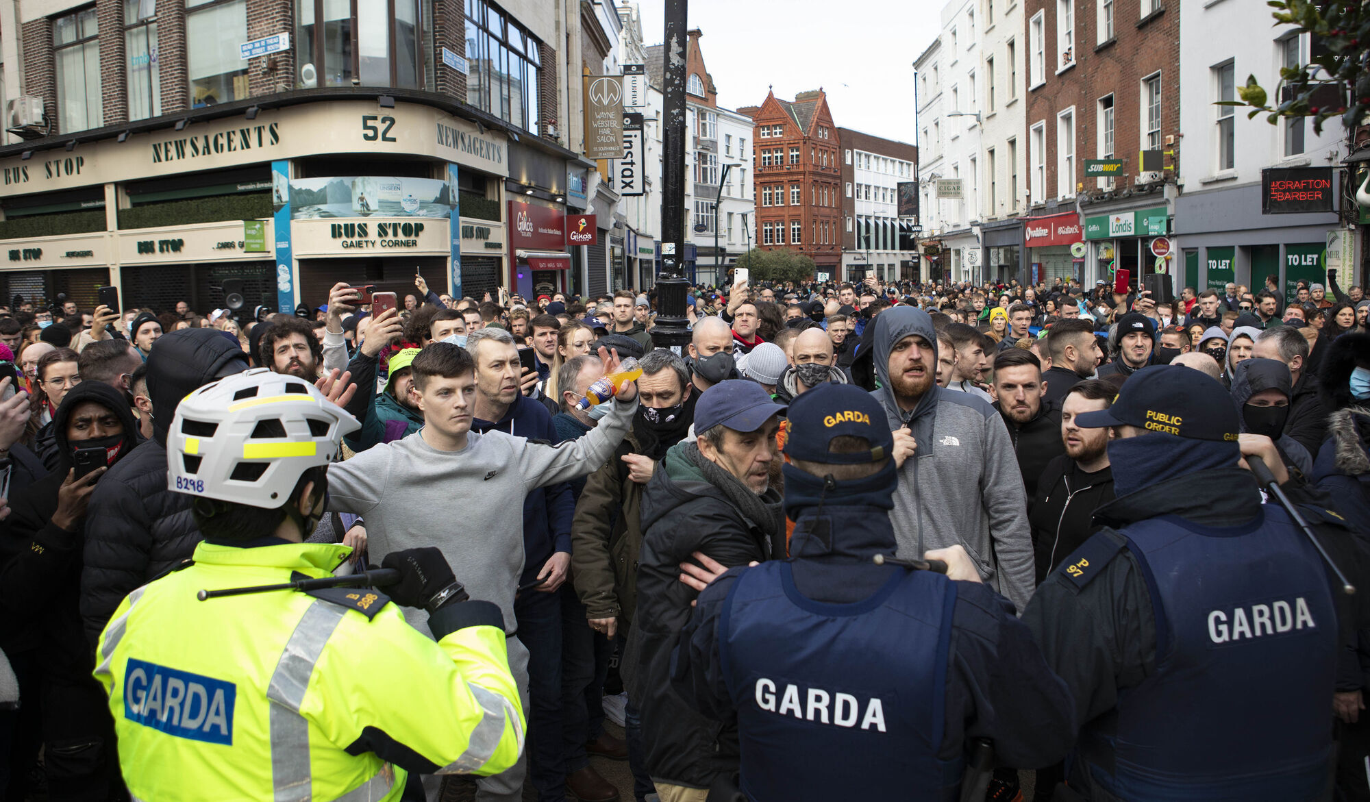 Gardaí confronting protesters during an anti-lockdown protest in Dublin city centre last month. Picture: Damian Eagers/PA Wire