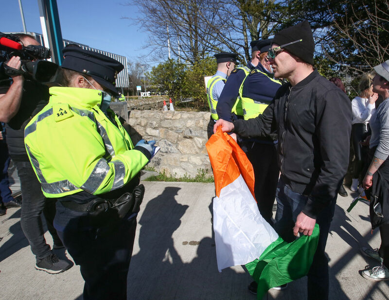 Gardaí take the names of lockdown protestors who arrived at the gates of RTÉ on Wednesday afternoon. Picture: Sam Boal / RollingNews.ie