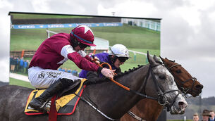 <p>Farclas, left, with Jack Kennedy up, races alongside Mr Adjudicator, with Paul Townend up, who finished second, on their way to winning the JCB Triumph Hurdle on Day Four of the 2018 Cheltenham Festival. Picture: Seb Daly/Sportsfile</p>
