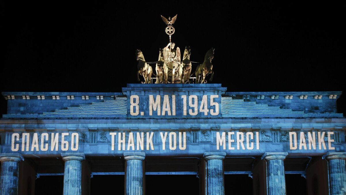 Germany's Brandenburg Gate illuminated to mark the 75th anniversary of Victory Day and the end of World War II in Europe on May 8, 2020. Picture: AP/ Markus Schreiber