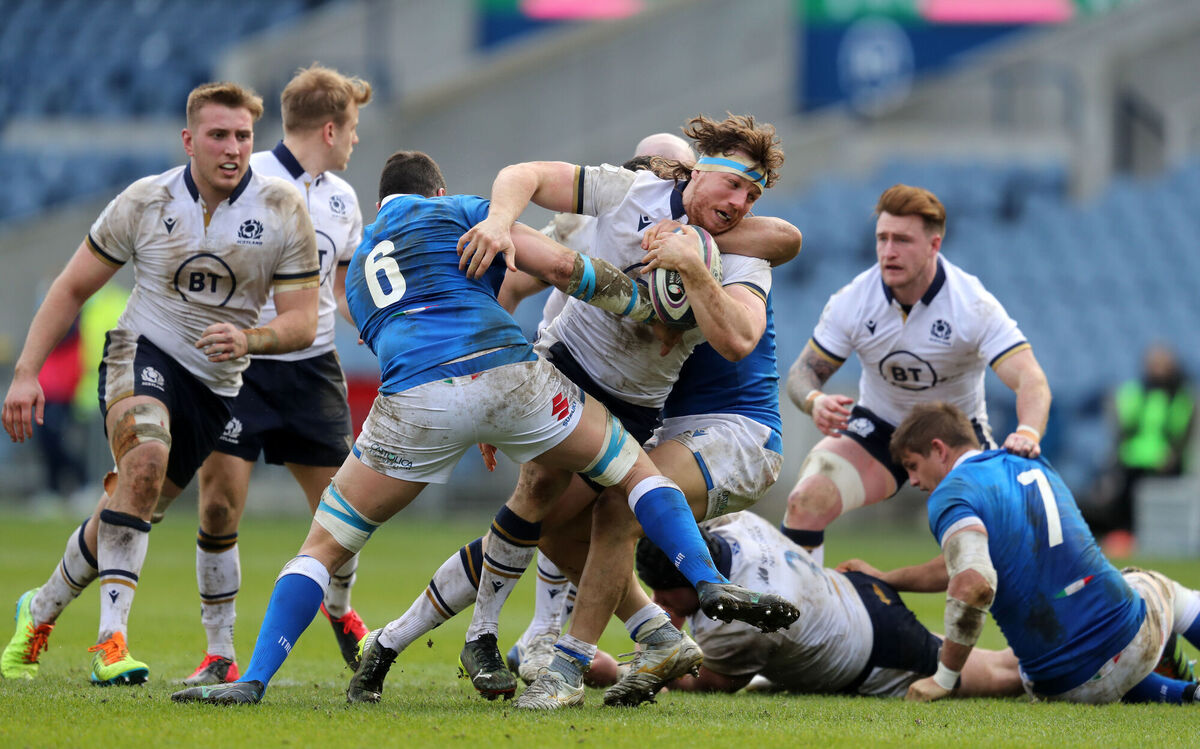 Scotland's Hamish Watson is tackled by Italy's Sebastian Negri. Picture: Jane Barlow
