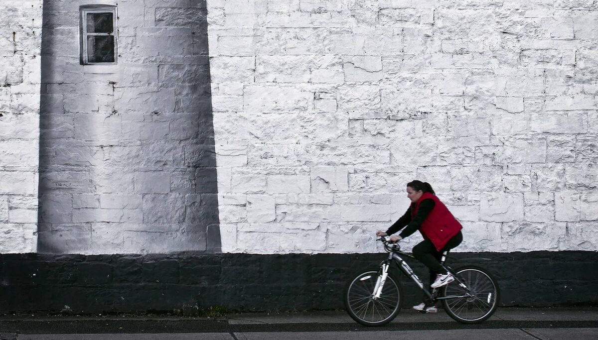 A person cycles by a mural in Sligo Town. Picture courtesy of Sligo.ie