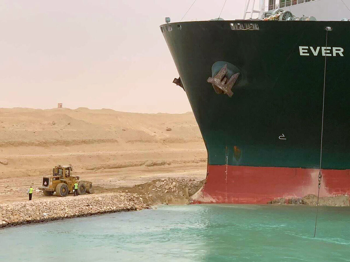 A cargo ship, named the Ever Green, sits with its bow stuck into the wall Wednesday, March 24, 2021, after it turned sideways in Egypt’s Suez Canal, blocking traffic in a crucial East-West waterway for global shipping. Picture: Suez Canal Authority via AP