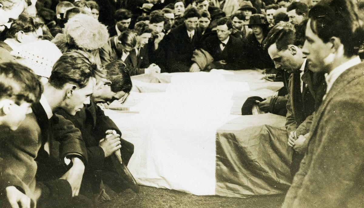 Mourners pray over the coffins of the IRA volunteers killed in the Clogheen Ambush. Picture: Courtesy National Museum of Ireland Mourners pray over the coffins of the IRA volunteers killed in the Clogheen Ambush. Picture: Courtesy National Museum of Ireland
