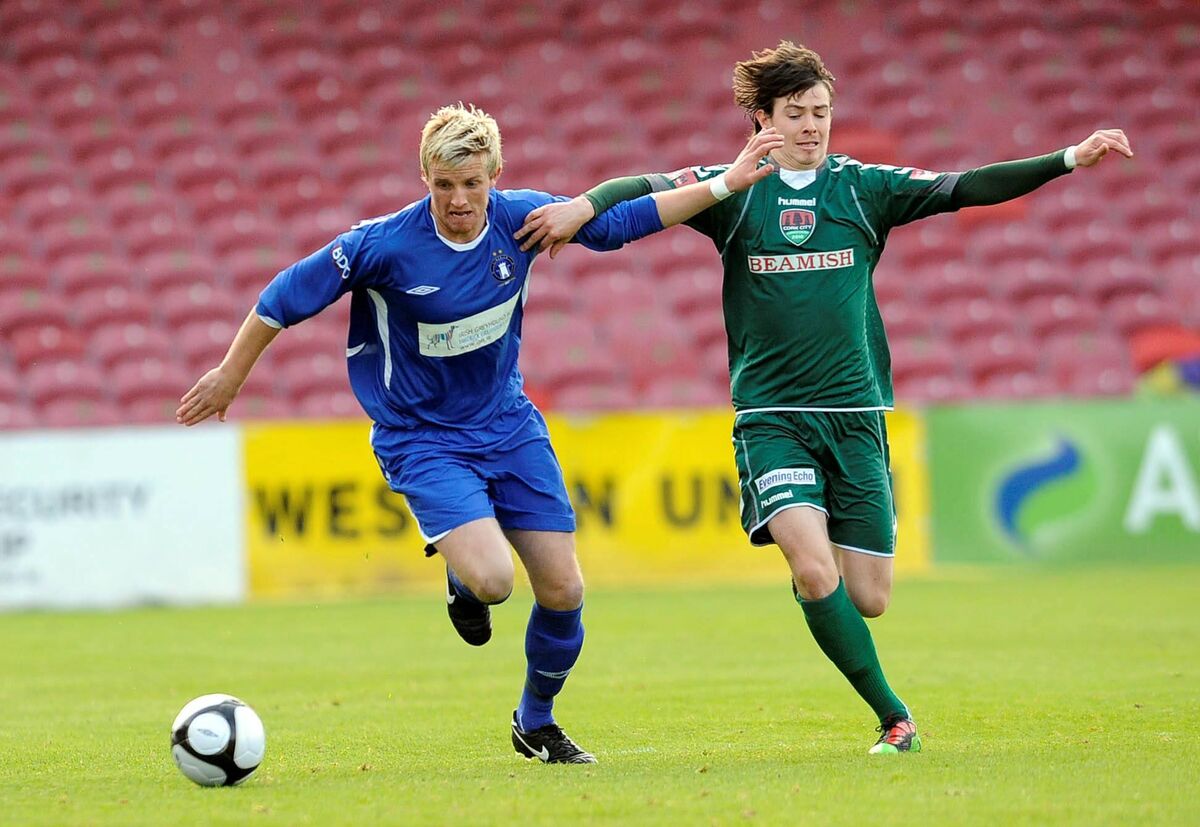 CHALLENGING TIMES: Paul Deasy, right, of Cork City Foras Co-Op holds off Limerick’s Sean Kelly in their EA Sports Cup meeting at Turner’s Cross back in 2010. Deasy is now the commercial manager at City. Pictures: Dan Linehan
                    