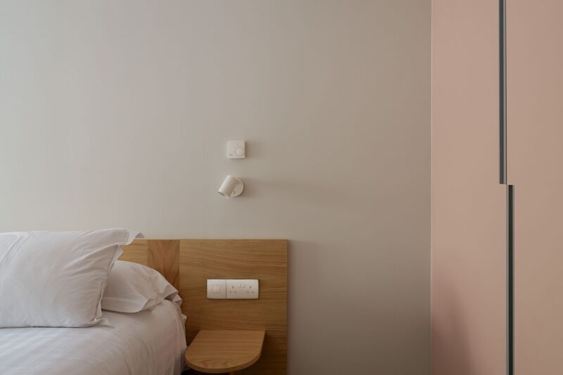 Bespoke headboards and compact bedside tables, with wall-mounted reading lamps maximise the limited space in bedrooms. Bespoke headboards and compact bedside tables, with wall-mounted reading lamps maximise the limited space in bedrooms.