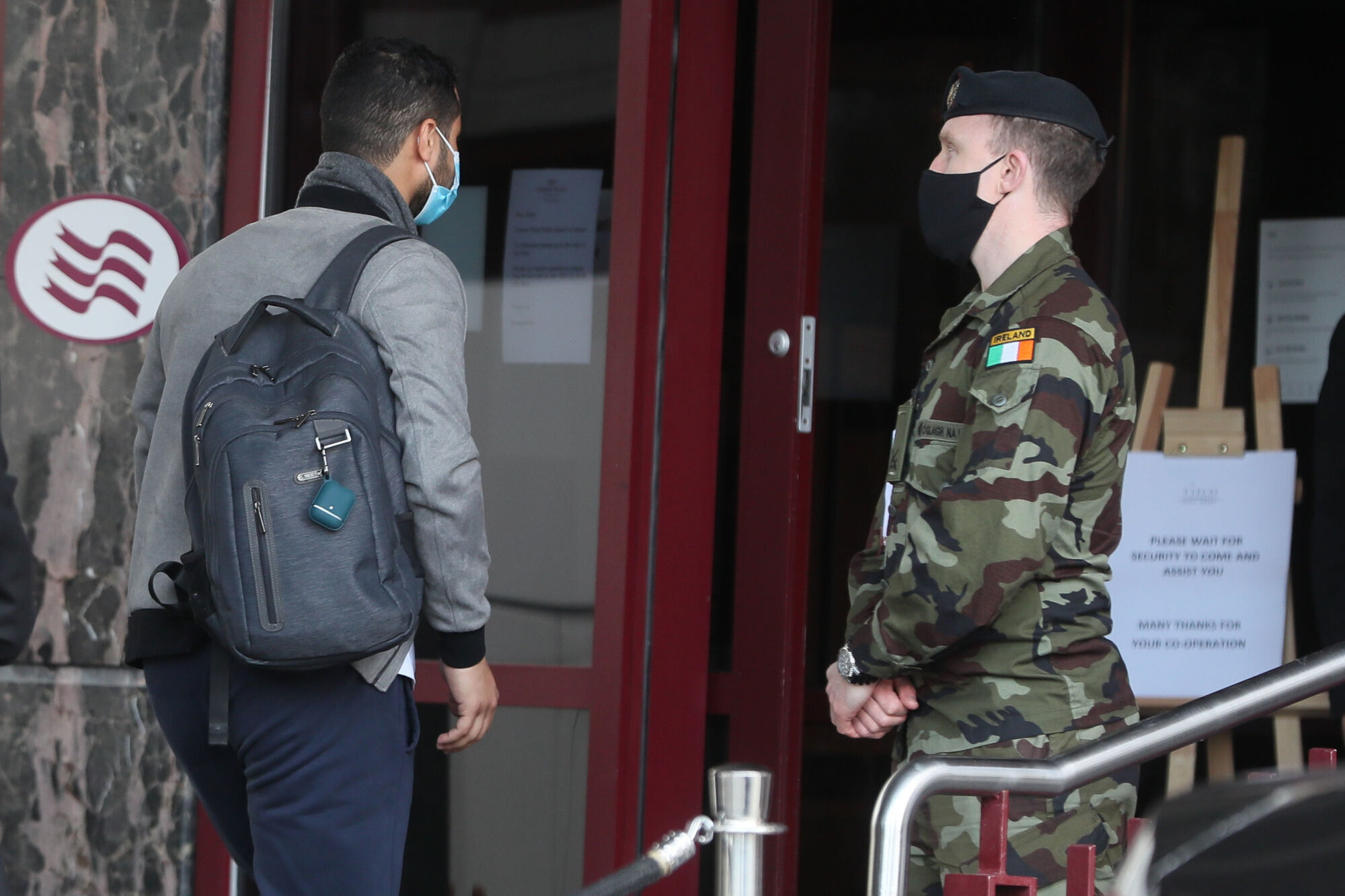 A traveller enters the Crowne Plaza hotel, Santry, near Dublin Airport, where he will stay during a mandatory 12-day quarantine after arriving from one of 33 high risk countries.Picture: Brian Lawless/PA Wire