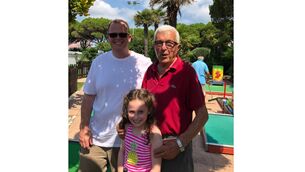 <p>Brian and his daughter meeting the former owner of the crazy gold course</p>