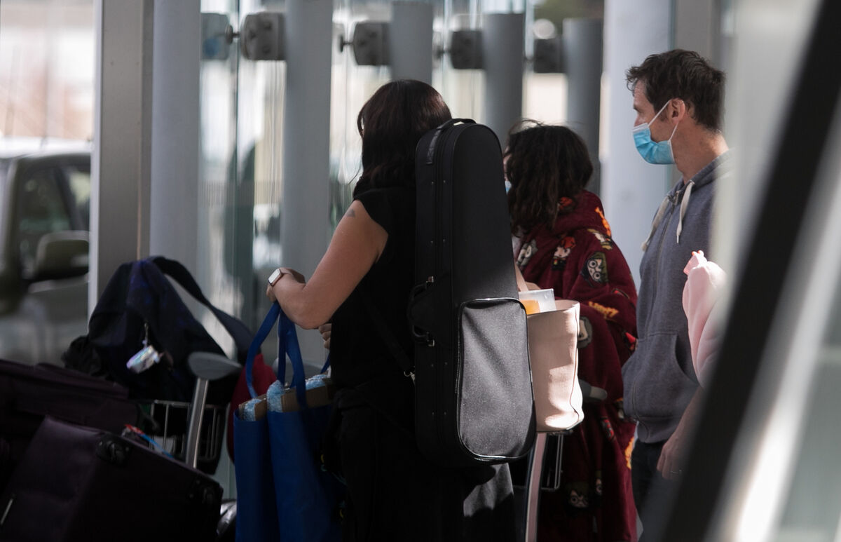 Travellers boarding a bus at Dublin airport as part of Irelands mandatory quarantine regime Picture: Gareth Chaney/Collins