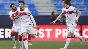 <p>Turkey's midfielder Ozan Tufan (C) celebrates with defenders Umut Meras (L) and Caglar Soyuncu after scoring a goal during the FIFA World Cup Qatar 2022 qualification football match between Norway and Turkey at La Rosaleda stadium in Malaga on March 27, 2021. (Photo by JORGE GUERRERO / AFP) (Photo by JORGE GUERRERO/AFP via Getty Images)</p>