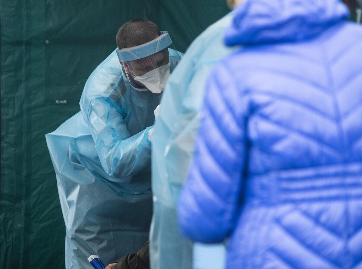 A National Ambulance Service staff member performs a Covid test at the pop-up test centre at the National Aquatic Centre, Blanchardstown. Picture: Colin Keegan, Collins Dublin A National Ambulance Service staff member performs a Covid test at the pop-up test centre at the National Aquatic Centre, Blanchardstown. Picture: Colin Keegan, Collins Dublin