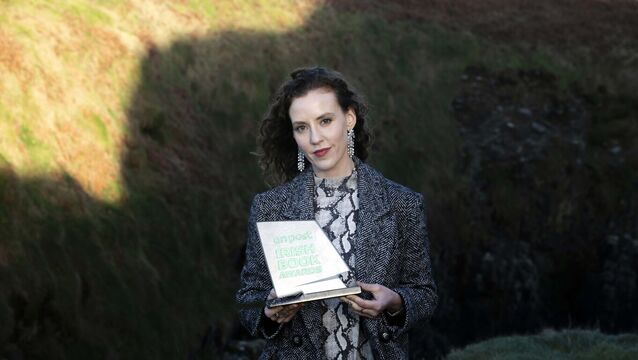 <p>Louise O’Neill with her An Post Irish Crime Novel of the Year award for ‘After the Silence’, which is to be adapted for screen. Picture: Clare Keogh</p>