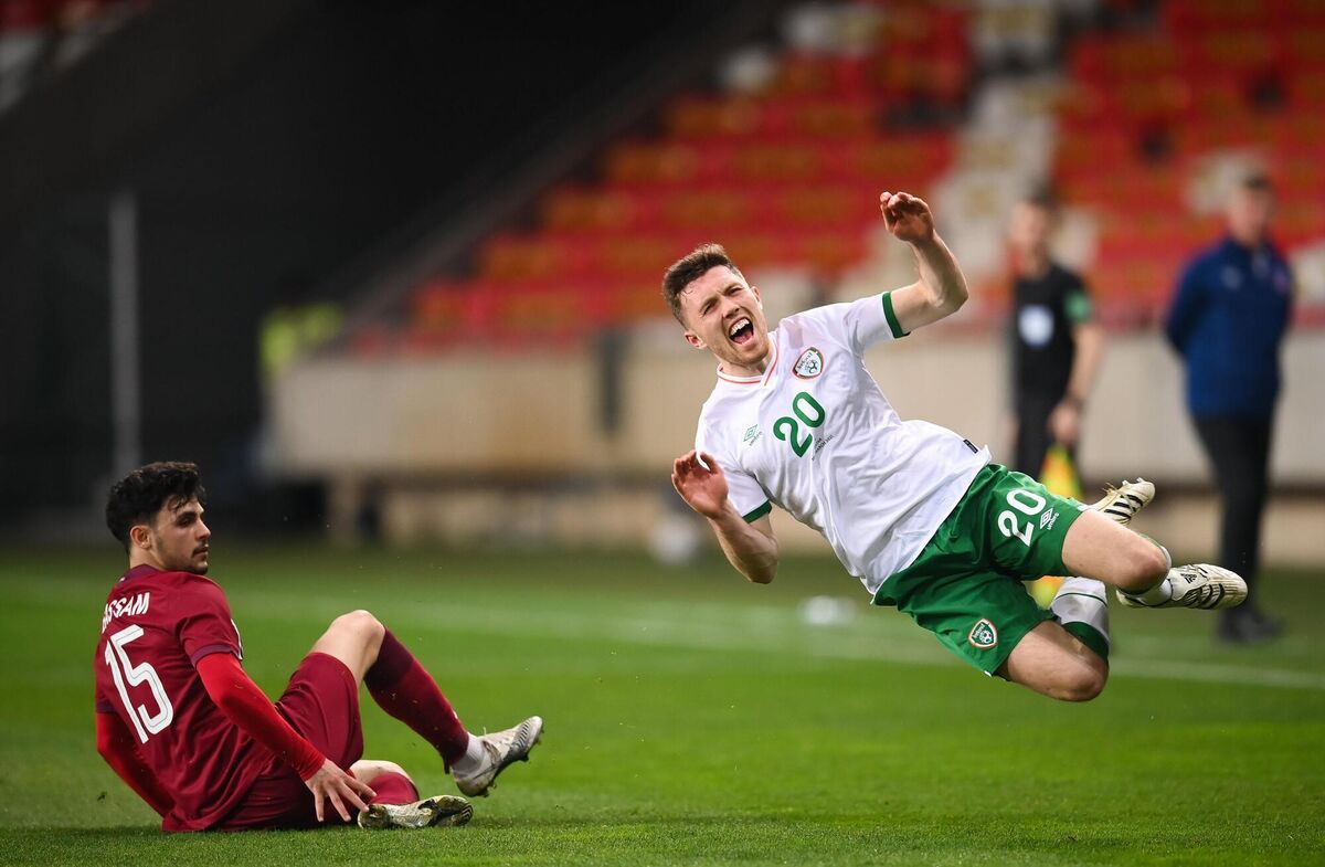 Dara O'Shea is tackled by Bassam Alrawi of Qatar. Photo by Stephen McCarthy/Sportsfile Dara O'Shea is tackled by Bassam Alrawi of Qatar. Photo by Stephen McCarthy/Sportsfile