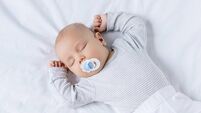 sleeping baby with toy