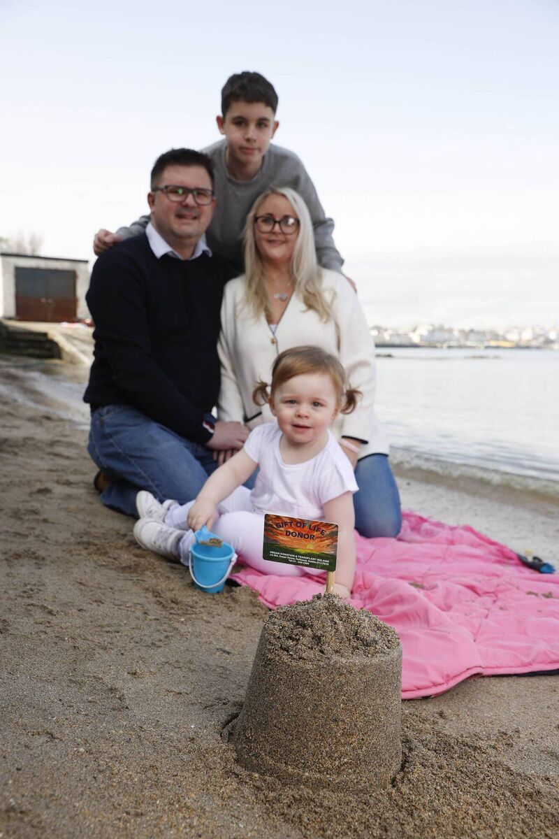 Lorna McSwiggan with her husband, Richard Martin, and her two children Kai and Nadia. Picture: Conor McCabe