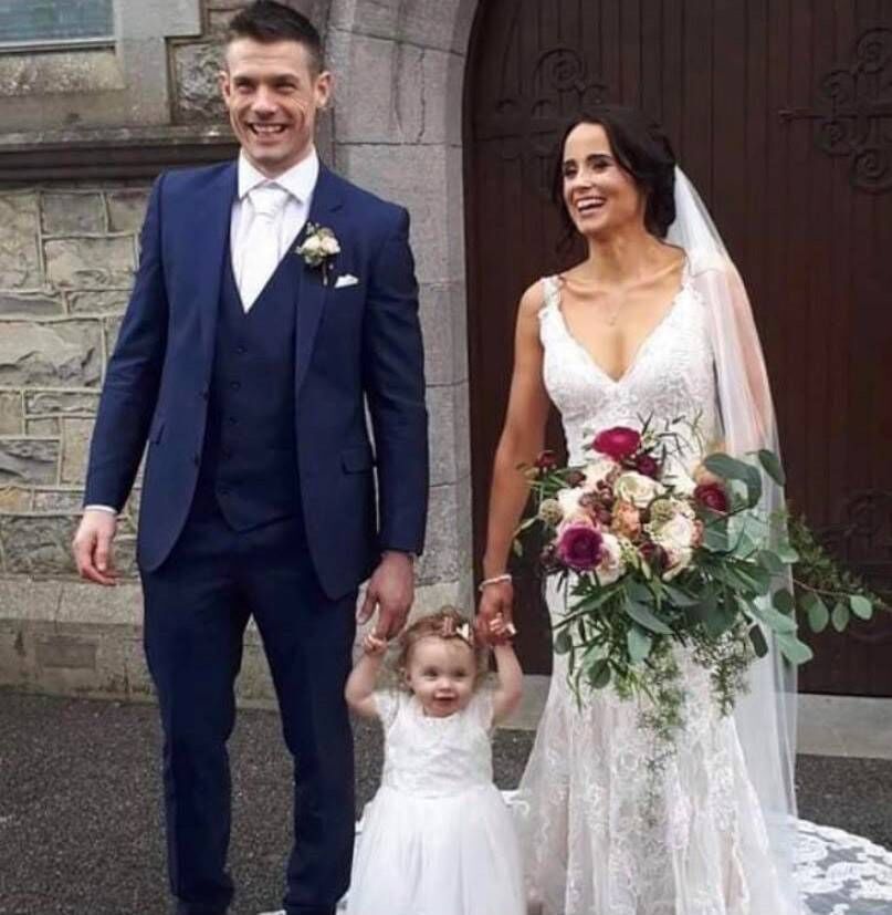 Sinead Lowndes on her wedding day with husband Stuart and daughter Paige. 