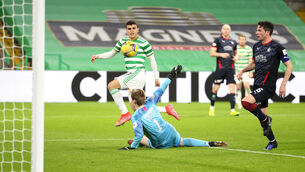 <p>Mohamed Elyounoussi scores Celtic's third goal at Celtic Park. Photo: Jane Barlow/PA</p>