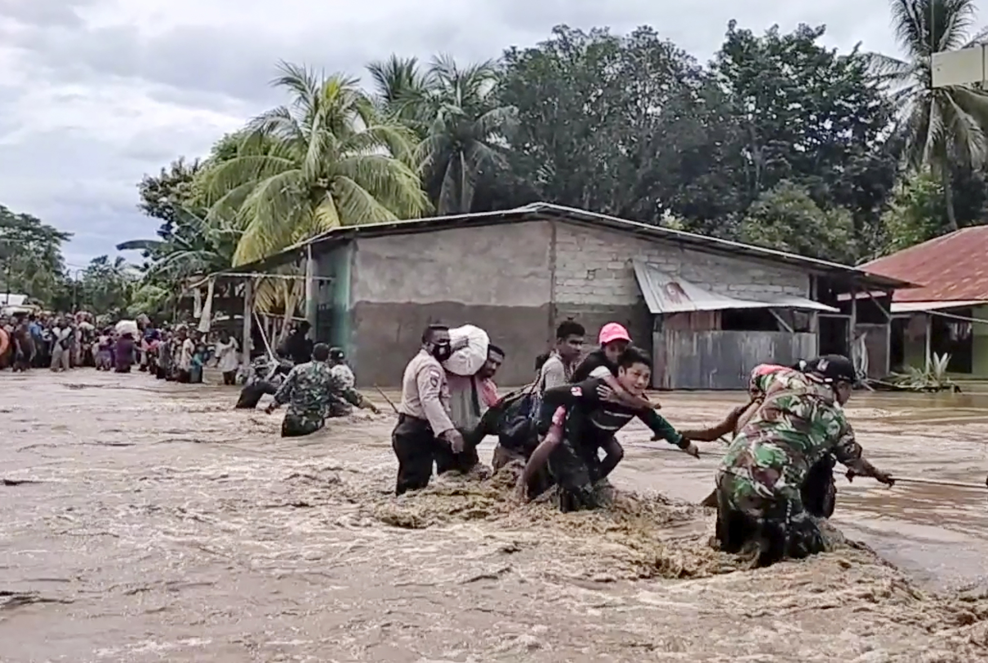 Rescue efforts hampered as flash floods and landslides in Indonesia kill dozens