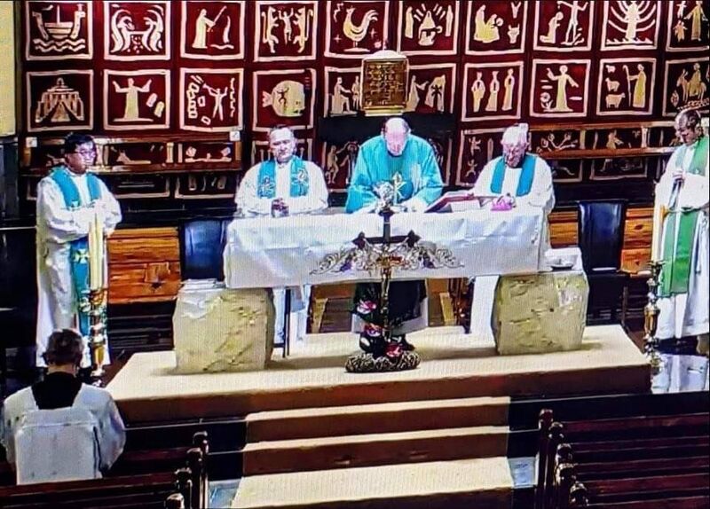 Screenshot of the Mass celebrated by Bishop of Waterford and Lismore Alphonsus Cullinan in close proximity to other priests. None were wearing masks.