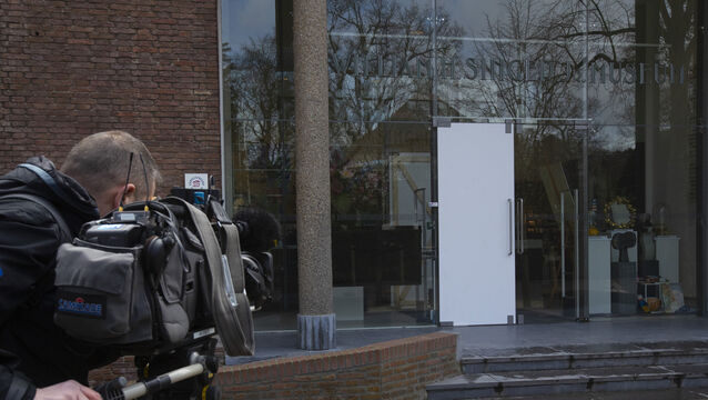 The glass door which was smashed during a break-in at the Singer Museum in Laren, Netherlands (Peter Dejong/AP)