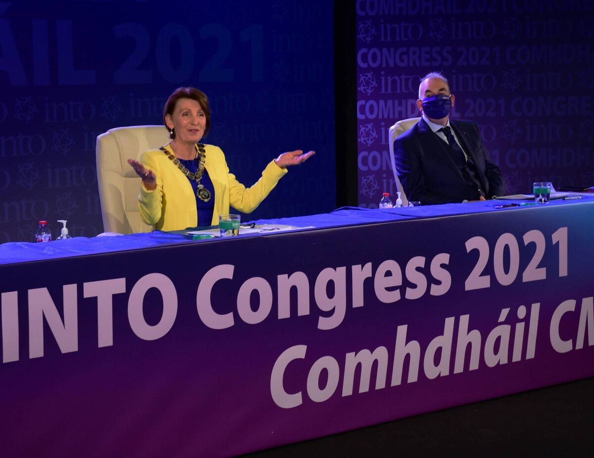 Mary Magnier, president of the Irish National Teachers' Organisation, watched by John Boyle, general secretary, as shewelcomes delegates online to the union's virtual congress. Picture: Moya Nolan