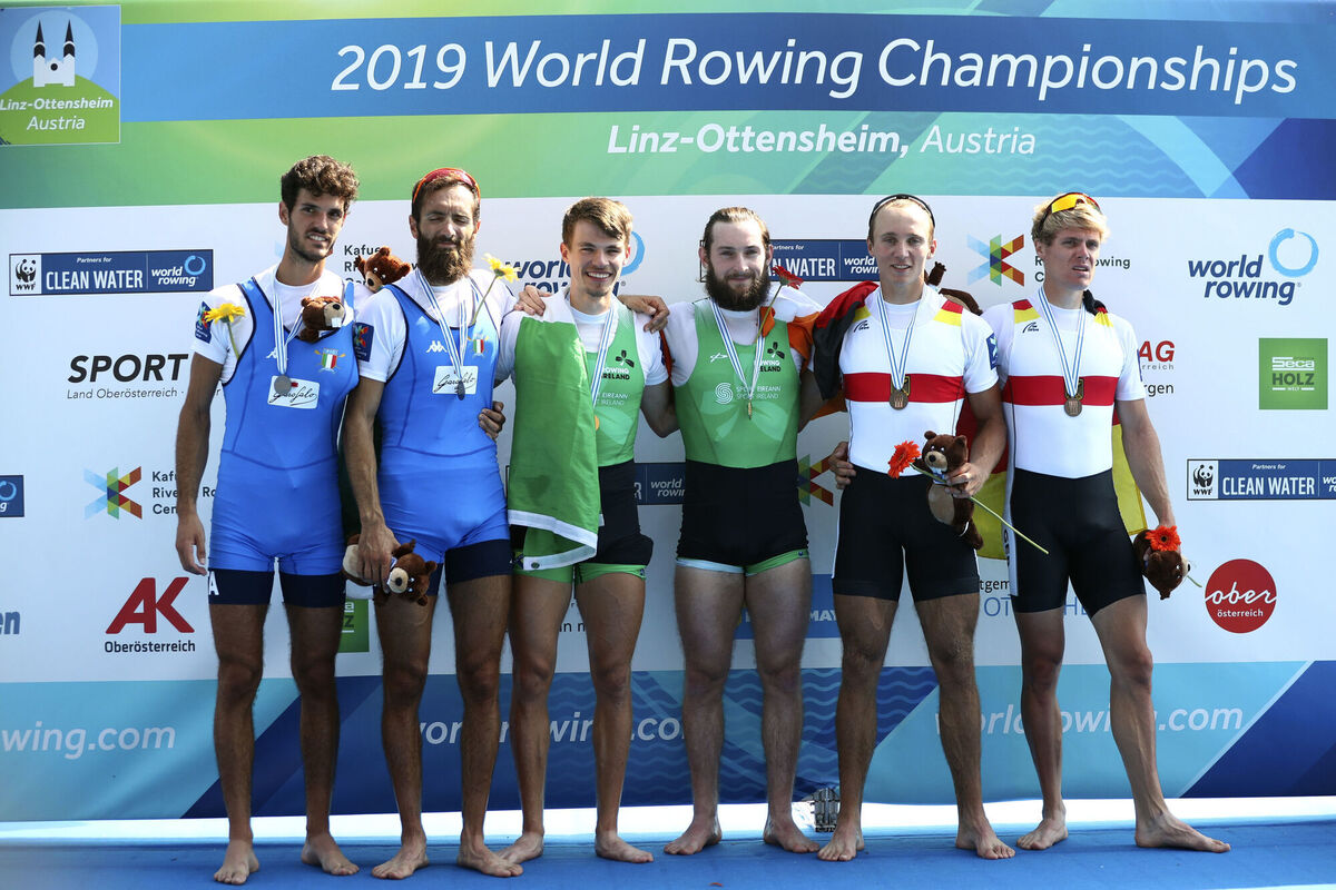 Silver medalists Stefano Oppo and Pietro Ruta of Italy, gold medalists Fintan McCarthy and Paul O'Donovan of Ireland and bronze medalists Jonathan Rommelmann and Jason Osborne of Germany, from left pose on the podium of the Lightweight Men's Double Sculls final at the World Rowing Championships in Ottensheim in 2019. Picture: Matthias Schrader Silver medalists Stefano Oppo and Pietro Ruta of Italy, gold medalists Fintan McCarthy and Paul O'Donovan of Ireland and bronze medalists Jonathan Rommelmann and Jason Osborne of Germany, from left pose on the podium of the Lightweight Men's Double Sculls final at the World Rowing Championships in Ottensheim in 2019. Picture: Matthias Schrader