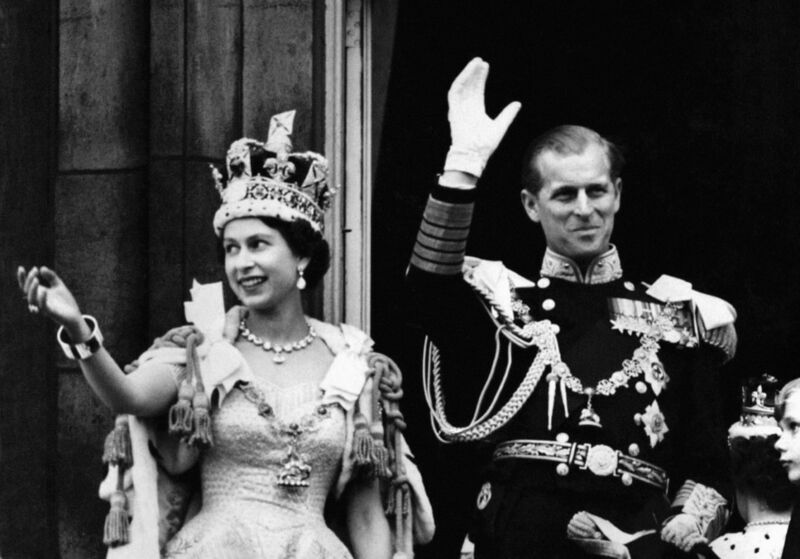 Queen Elizabeth II wearing the Imperial State Crown and the Duke of Edinburgh in uniform of Admiral of the Fleet waving from the balcony to the on looking crowds around the gates of Buckingham Palace after the Coronation in 1953. Queen Elizabeth II wearing the Imperial State Crown and the Duke of Edinburgh in uniform of Admiral of the Fleet waving from the balcony to the on looking crowds around the gates of Buckingham Palace after the Coronation in 1953.