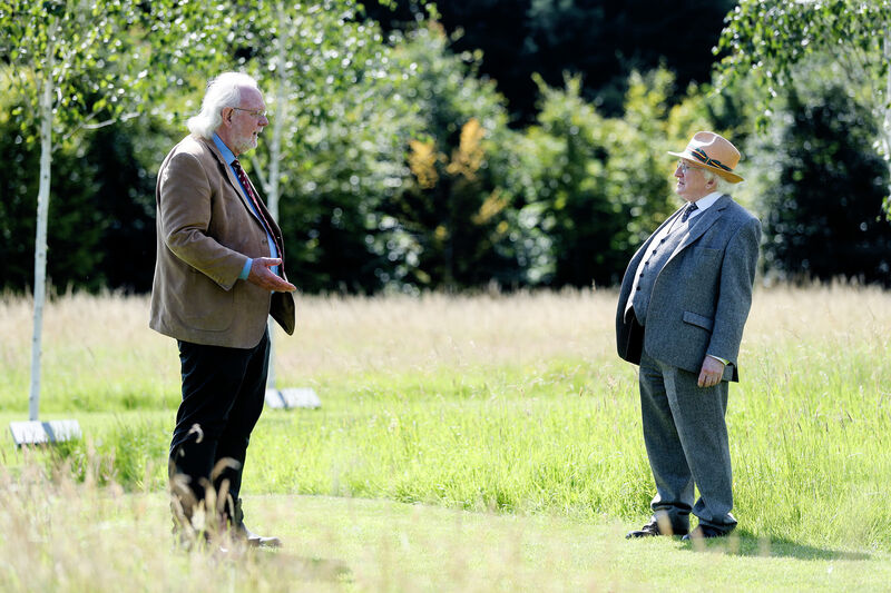 President Higgins meets with former director of Dublin Zoo Leo Oosterweghel in the gardens at Áras an Uachtaráin.
